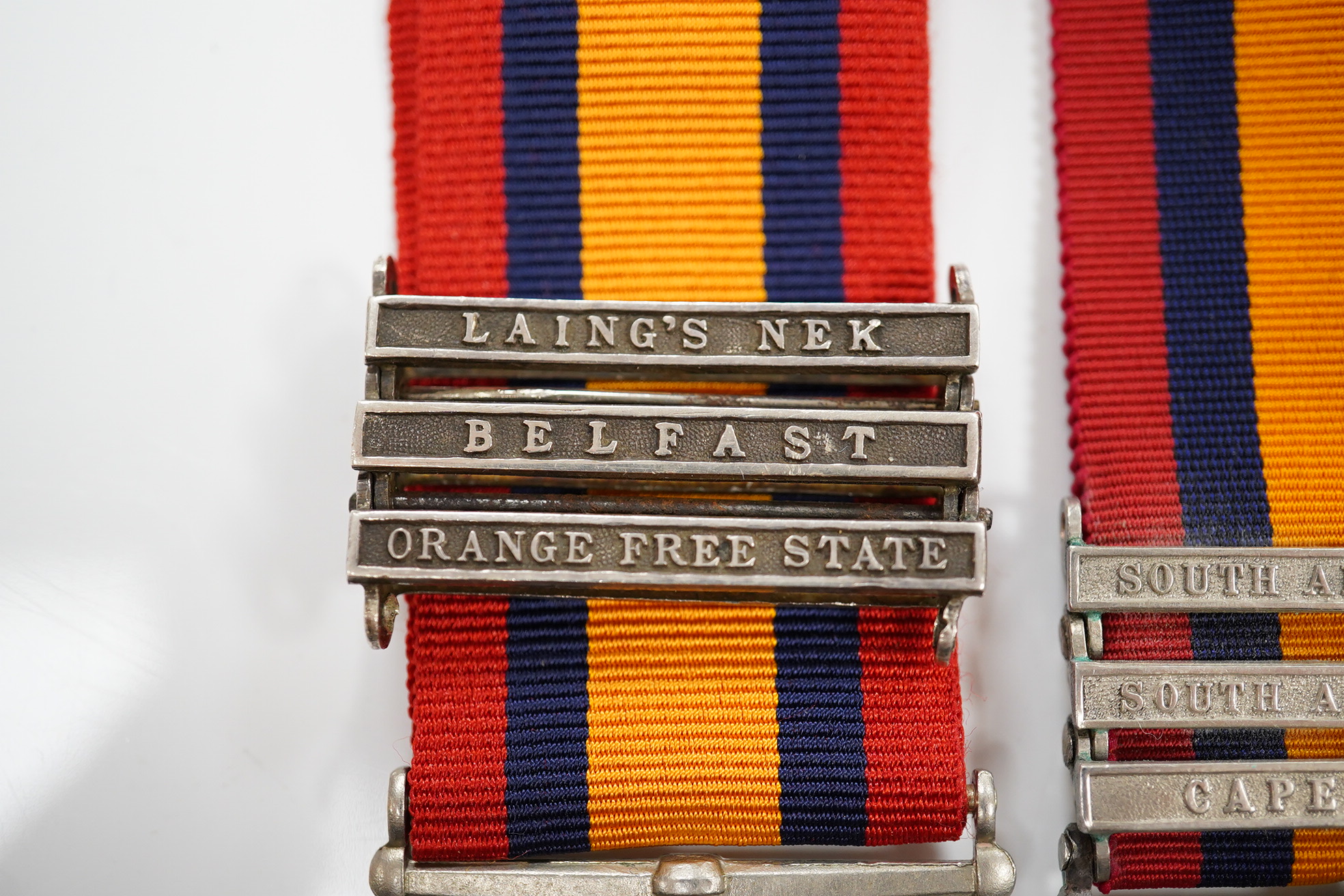 A Queen's South Africa Medal with Laings Nek, Belfast and OFS clasps to 12036 Bomr M.Miller R.F.A.Arty, another unnamed with 1901, 1902 and CC clasps, and two King's South Africa medals both with 1901/1902 clasps to 6408